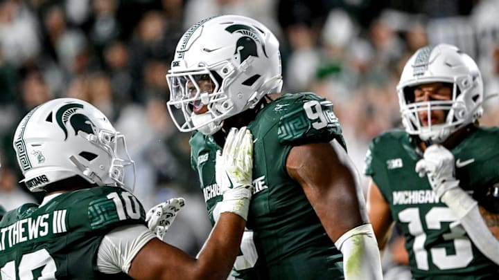 Michigan State's Jalen Thompson, right, celebrates his tackle for a safety against Western Michigan during the third quarter on Friday, Aug. 29, 2025, in East Lansing.