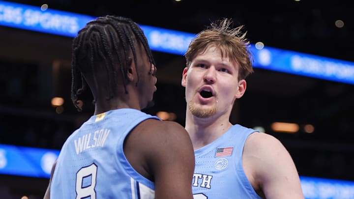 Dec 20, 2025; Atlanta, Georgia, USA; North Carolina Tar Heels forward Caleb Wilson (8) and center Henri Veesaar (13) celebrate after a basket against the Ohio State Buckeyes in the second half at State Farm Arena. Mandatory Credit: Brett Davis-Imagn Images
