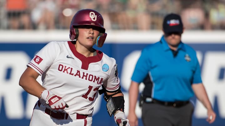 Oklahoma Sooners catcher Isabela Emerling (13) round the bases after a home run in the second inning against the Oregon Ducks during the NCAA Softball Women's College World Series at Devon Park. Oklahoma Sooners catcher Isabela Emerling (13) round the bases after a home run in the second inning against the Oregon Ducks during the NCAA Softball Women's College World Series at Devon Park.