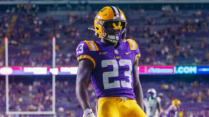 LSU Tigers running back Stacy Gage (23) rushes for a touchdown against McNeese Cowboys defensive end RJ Staten (23) during the second half at Tiger Stadium.