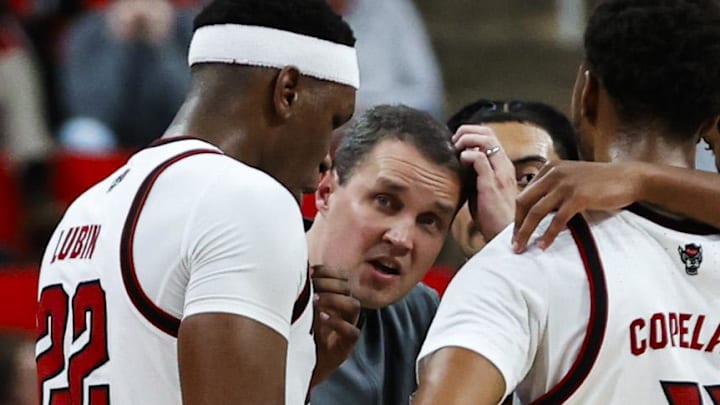 Dec 6, 2025; Raleigh, North Carolina, USA; NC State Wolfpack huddle with head coach Will Wade during the second half of the game against UNC Asheville Bulldogs at Lenovo Center. Mandatory Credit: Jaylynn Nash-Imagn Images Dec 6, 2025; Raleigh, North Carolina, USA; NC State Wolfpack huddle with head coach Will Wade during the second half of the game against UNC Asheville Bulldogs at Lenovo Center. Mandatory Credit: Jaylynn Nash-Imagn Images