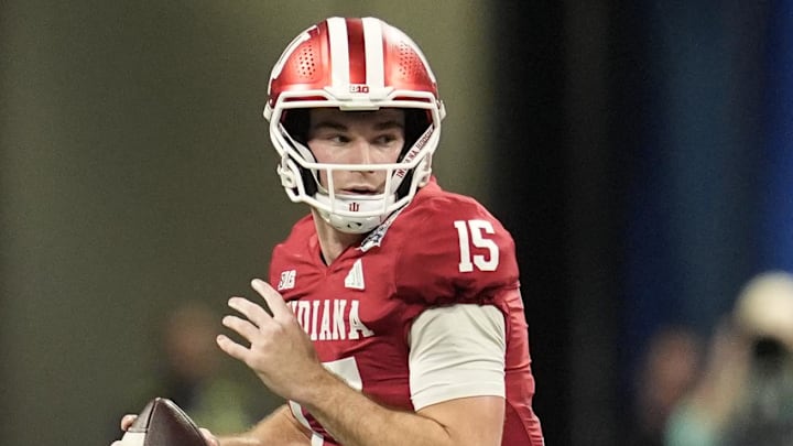 Jan 9, 2026; Atlanta, GA, USA; Indiana Hoosiers quarterback Fernando Mendoza (15) scrambles against the Oregon Ducks during the first half of the 2025 Peach Bowl and semifinal game of the College Football Playoff at Mercedes-Benz Stadium. Mandatory Credit: Dale Zanine-Imagn Images Jan 9, 2026; Atlanta, GA, USA; Indiana Hoosiers quarterback Fernando Mendoza (15) scrambles against the Oregon Ducks during the first half of the 2025 Peach Bowl and semifinal game of the College Football Playoff at Mercedes-Benz Stadium. Mandatory Credit: Dale Zanine-Imagn Images