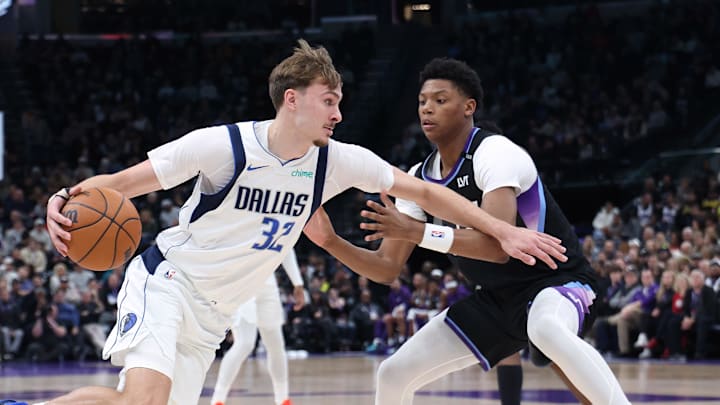 Dec 15, 2025; Salt Lake City, Utah, USA; Dallas Mavericks forward Cooper Flagg (32) drives to the basket against Utah Jazz guard Ace Bailey (19) during the second quarter at Delta Center. Mandatory Credit: Rob Gray-Imagn Images