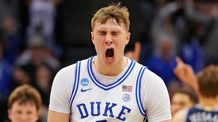 Mar 27, 2025; Newark, NJ, USA; Duke Blue Devils forward Cooper Flagg (2) reacts after making a last second shot to end the first half against the Arizona Wildcats during an East Regional semifinal of the 2025 NCAA tournament at Prudential Center. Mandatory Credit: Robert Deutsch-Imagn Images Mar 27, 2025; Newark, NJ, USA; Duke Blue Devils forward Cooper Flagg (2) reacts after making a last second shot to end the first half against the Arizona Wildcats during an East Regional semifinal of the 2025 NCAA tournament at Prudential Center. Mandatory Credit: Robert Deutsch-Imagn Images