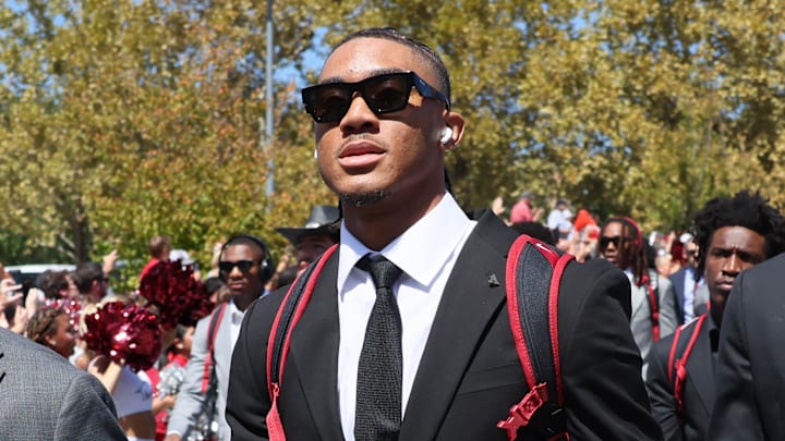 Sep 14, 2024; Fayetteville, Arkansas, USA; Arkansas Razorbacks quarterback Taylen Green (center) and defensive end Landon Jackson (right) during the Hog Walk prior to the game against the UAB Blazers at Donald W. Reynolds Razorback Stadium. Mandatory Credit: Nelson Chenault-Imagn Images