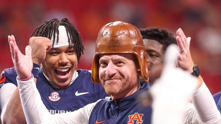 Sep 5, 2026; Atlanta, Georgia, USA; Auburn Tigers head coach Alex Golesh wears the old leather helmet after a victory over the Baylor Bears at Mercedes-Benz Stadium. Mandatory Credit: Brett Davis-Imagn Images Sep 5, 2026; Atlanta, Georgia, USA; Auburn Tigers head coach Alex Golesh wears the old leather helmet after a victory over the Baylor Bears at Mercedes-Benz Stadium. Mandatory Credit: Brett Davis-Imagn Images