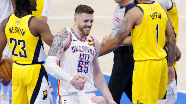 Jun 5, 2025; Oklahoma City, Oklahoma, USA; Oklahoma City Thunder center Isaiah Hartenstein (55) helps up guard Alex Caruso (9) during the fourth quarter against the Indiana Pacers during game one of the 2025 NBA Finals at Paycom Center. Mandatory Credit: Alonzo Adams-Imagn Images Jun 5, 2025; Oklahoma City, Oklahoma, USA; Oklahoma City Thunder center Isaiah Hartenstein (55) helps up guard Alex Caruso (9) during the fourth quarter against the Indiana Pacers during game one of the 2025 NBA Finals at Paycom Center. Mandatory Credit: Alonzo Adams-Imagn Images