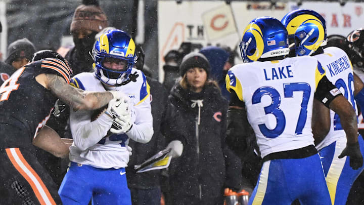 Jan 18, 2026; Chicago, IL, USA; Los Angeles Rams cornerback Cobie Durant (14) intercepts a pass intended for Chicago Bears tight end Colston Loveland (84) during the third quarter of an NFC Divisional Round game at Soldier Field. Mandatory Credit: Matt Marton-Imagn Images