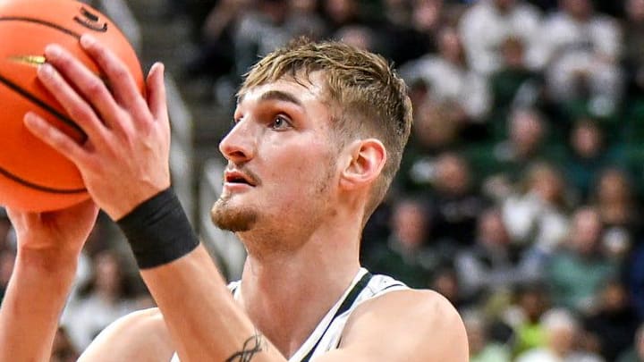 Michigan State's Carson Cooper scores against Ohio State during the second half on Sunday, Feb. 22, 2026, at the Breslin Center in East Lansing.