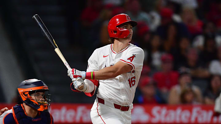 Sep 13, 2024; Anaheim, California, USA; Los Angeles Angels center fielder Mickey Moniak (16) hits a solo home run against the Houston Astros during the fourth inning at Angel Stadium.