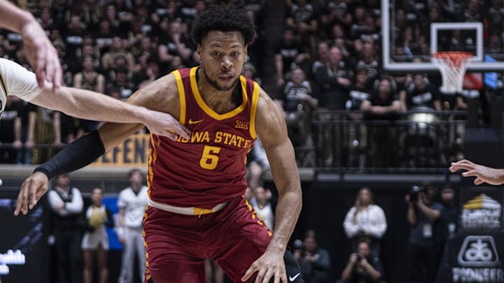 Dec 6, 2025; West Lafayette, Indiana, USA; Iowa State Cyclones forward Joshua Jefferson (5) dribbles past Purdue Boilermakers guard Jack Benter (14) during the first half at Mackey Arena. 