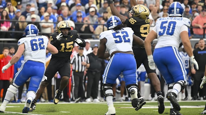 Nov 22, 2025; Nashville, Tennessee, USA; Vanderbilt Commodores defensive lineman Khordae Sydnor (96) tips the pass of Kentucky Wildcats quarterback Cutter Boley (8) during the first half at FirstBank Stadium. Mandatory Credit: Steve Roberts-Imagn Images Nov 22, 2025; Nashville, Tennessee, USA; Vanderbilt Commodores defensive lineman Khordae Sydnor (96) tips the pass of Kentucky Wildcats quarterback Cutter Boley (8) during the first half at FirstBank Stadium. Mandatory Credit: Steve Roberts-Imagn Images