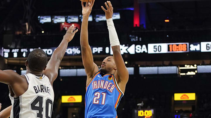 Oct 7, 2024; San Antonio, Texas, USA; Oklahoma City Thunder guard Aaron Wiggins (21) shoots over San Antonio Spurs forward Harrison Barnes (40) during the second half at Frost Bank Center. Mandatory Credit: Scott Wachter-Imagn Images