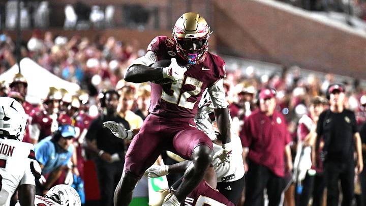 Aug 29, 2026; Tallahassee, Florida, USA; Florida State running back Ousmane Kromah (32) runs for a gain past New Mexico State wide receiver Myles Libman (5) during the second quarter at Doak S. Campbell Stadium. Mandatory Credit: Melina Myers-Imagn Images Aug 29, 2026; Tallahassee, Florida, USA; Florida State running back Ousmane Kromah (32) runs for a gain past New Mexico State wide receiver Myles Libman (5) during the second quarter at Doak S. Campbell Stadium. Mandatory Credit: Melina Myers-Imagn Images