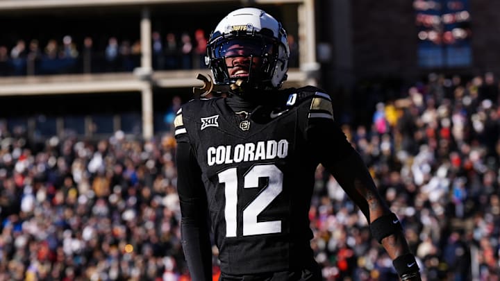 Nov 29, 2024; Boulder, Colorado, USA; Colorado Buffaloes wide receiver Travis Hunter (12) reacts in the first quarter against the Oklahoma State Cowboys at Folsom Field. Mandatory Credit: Ron Chenoy-Imagn Images