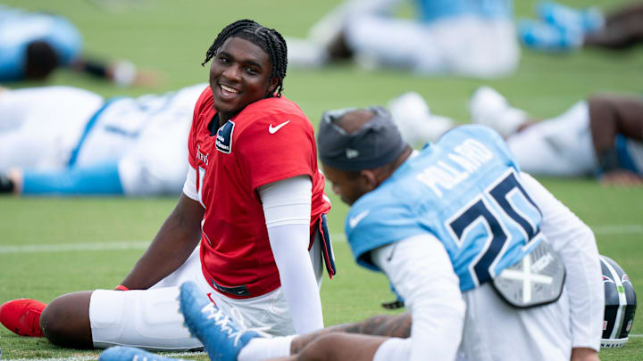 Tennessee Titans quarterback Cam Ward and running back Tony Pollard.