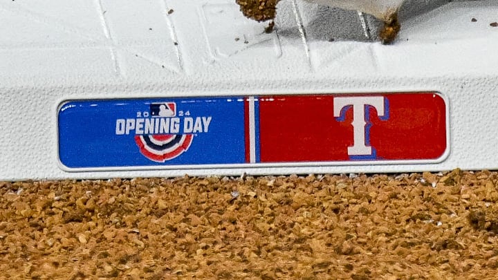 A view of third base and the Texas Rangers logo and Opening Day logo.