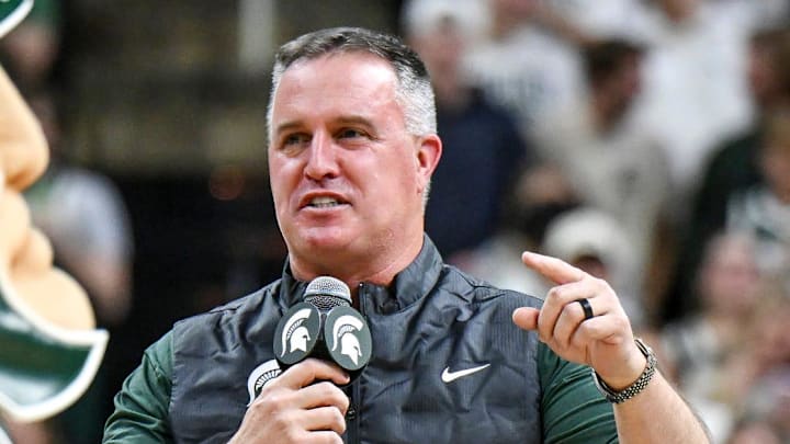 Michigan State's new football coach Pat Fitzgerald addresses the crowd during a timeout in the first half of the Spartans basketball game against Iowa on Tuesday, Dec. 2, 2025, at the Breslin Center in East Lansing.