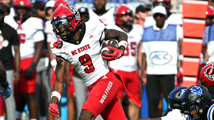 Sep 20, 2025; Durham, North Carolina, USA; North Carolina State Wolfpack wide receiver Terrell Anderson (9) runs the ball past Duke Blue Devils safety DaShawn Stone (8) during the first quarter at Wallace Wade Stadium. Mandatory Credit: Zachary Taft-Imagn Images