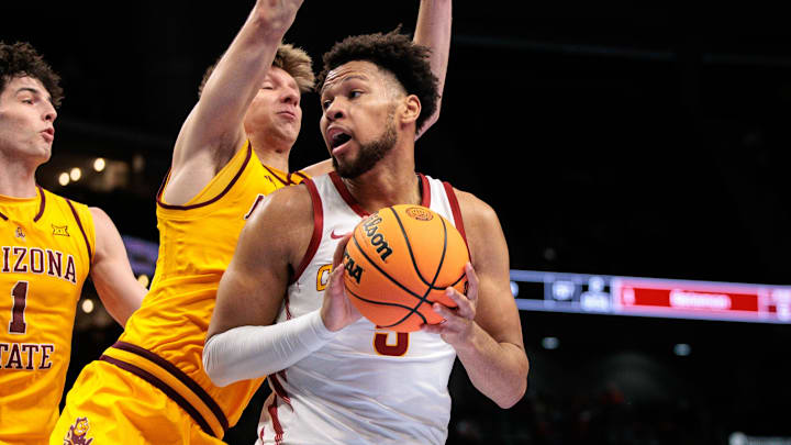 Mar 11, 2026; Kansas City, MO, USA; Iowa State Cyclones forward Joshua Jefferson (5) protects the ball during the first half against the Arizona State Sun Devils at T-Mobile Center. Mandatory Credit: William Purnell-Imagn Images