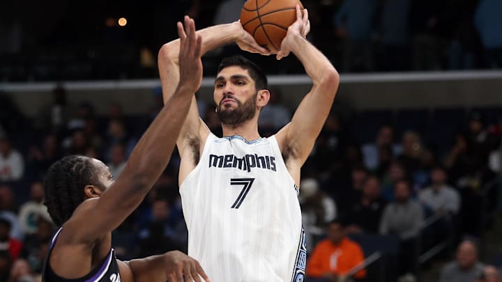 Nov 20, 2025; Memphis, Tennessee, USA; Memphis Grizzlies forward Santi Aldama (7) passes the ball as Sacramento Kings forward Dario Saric (9) defends during the fourth quarter at FedExForum. Mandatory Credit: Petre Thomas-Imagn Images