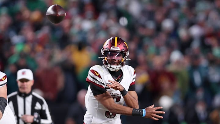 Jan 26, 2025; Philadelphia, PA, USA; Washington Commanders quarterback Jayden Daniels (5) passes the ball against the Philadelphia Eagles during the second half in the NFC Championship game at Lincoln Financial Field. Mandatory Credit: Bill Streicher-Imagn Images
