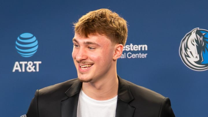 Apr 29, 2026; Dallas, TX, USA;  Dallas Maverick Cooper Flagg holds the  2025-26 NBA Rookie of the Year trophy as he stands with head coach Jason Kidd, who was NBA Co-Rookie of the Year for the 1994-95 season during a press conference at American Airlines Center. Mandatory Credit: Raymond Carlin III-Imagn Images