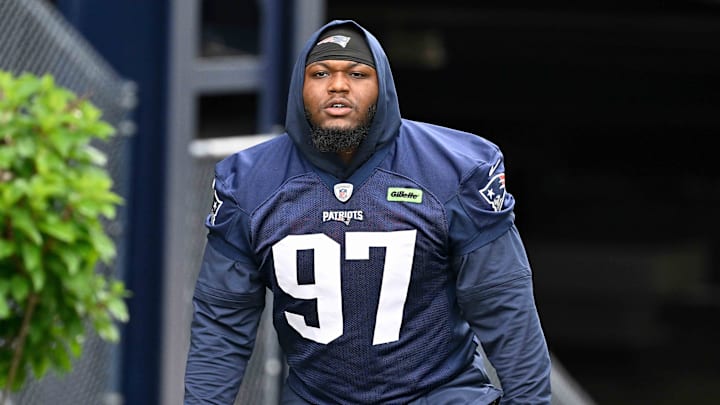 Jun 9, 2025; Foxborough, MA, USA; New England Patriots defensive end Milton Williams (97) walks to the practice fields at Gillette Stadium. Mandatory Credit: Eric Canha-Imagn Images