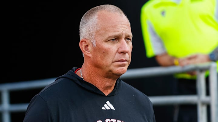 Aug 28, 2025; Raleigh, North Carolina, USA; North Carolina State Wolfpack head coach Dave Doeren walks out during the warmups prior to the game against East Carolina Pirates at Carter-Finley Stadium. Mandatory Credit: Jaylynn Nash-Imagn Images Aug 28, 2025; Raleigh, North Carolina, USA; North Carolina State Wolfpack head coach Dave Doeren walks out during the warmups prior to the game against East Carolina Pirates at Carter-Finley Stadium. Mandatory Credit: Jaylynn Nash-Imagn Images