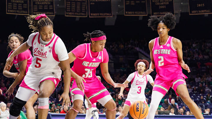 Notre Dame and NC State chase after a loose ball during an NCAA women's basketball game at Purcell Pavilion on Sunday, Feb. 15, 2026, in South Bend.