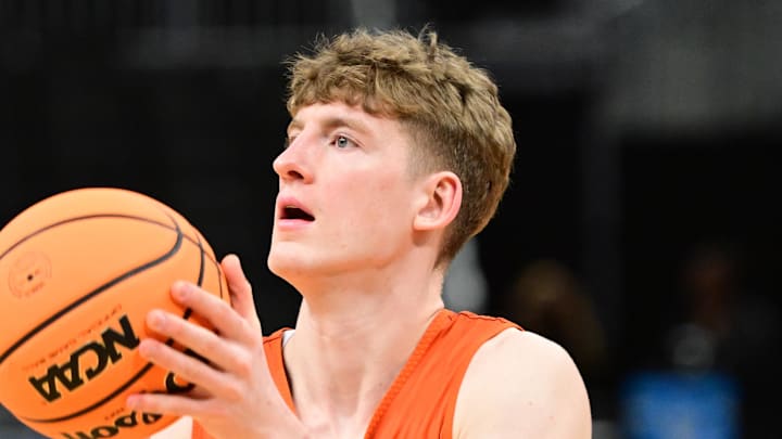 Mar 20, 2025; Milwaukee, WI, USA; Illinois Fighting Illini guard Kasparas Jakucionis (32) shoots the ball during NCAA Tournament First Round Practice at Fiserv Forum. Mandatory Credit: Benny Sieu-Imagn Images