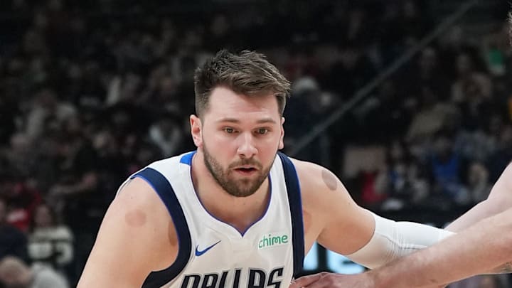 Dec 7, 2024; Toronto, Ontario, CAN; Dallas Mavericks guard Luka Doncic (77) controls the ball against Toronto Raptors center Jakob Poeltl (19) during the first quarter at Scotiabank Arena. Mandatory Credit: Nick Turchiaro-Imagn Images