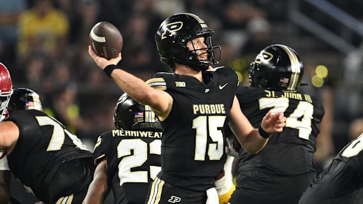 Purdue Boilermakers quarterback Ryan Browne (15) throws a pass