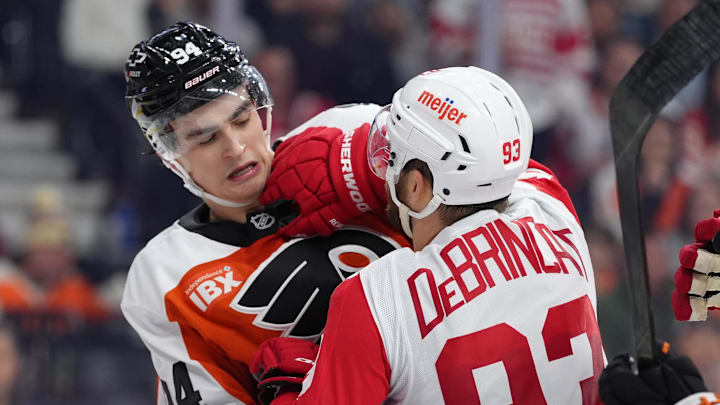 Apr 2, 2026; Philadelphia, Pennsylvania, USA; Philadelphia Flyers right wing Porter Martone (94) scuffles with Detroit Red Wings right wing Alex Debrincat (93) in the second period at Xfinity Mobile Arena. Mandatory Credit: Kyle Ross-Imagn Images