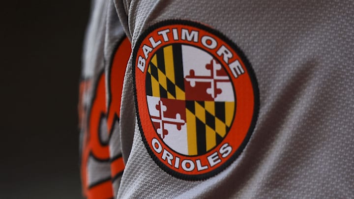May 5, 2024; Cincinnati, Ohio, USA; The Baltimore Orioles logo on the sleeve of designated hitter Gunnar Henderson (2) as he prepares on deck during the seventh inning against the Cincinnati Reds at Great American Ball Park. Mandatory Credit: Katie Stratman-Imagn Images