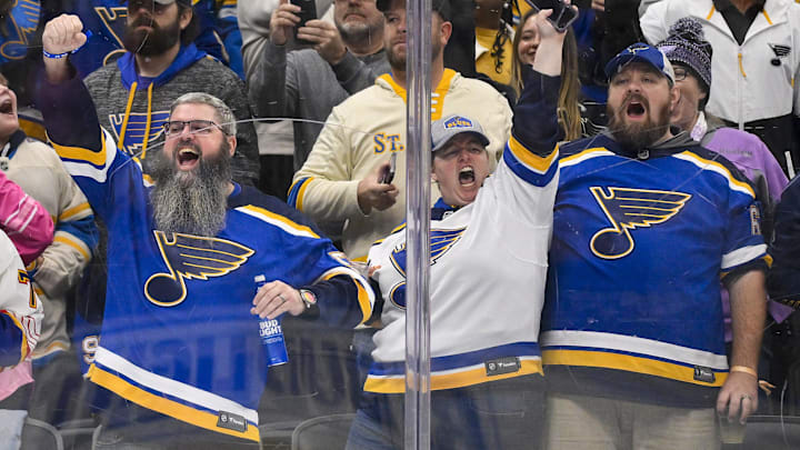 Oct 23, 2025; St. Louis, Missouri, USA; St. Louis Blues fans react after St. Louis Blues center Pius Suter (not pictured) scored against the Utah Mammoth during the second period at Enterprise Center. Mandatory Credit: Jeff Curry-Imagn Images
