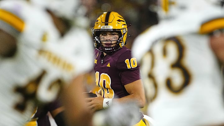 ASU quarterback Sam Leavitt looks for a receiver during a game against Wyoming at Mountain America Stadium on Aug. 31, 2024, in Tempe. ASU quarterback Sam Leavitt looks for a receiver during a game against Wyoming at Mountain America Stadium on Aug. 31, 2024, in Tempe.
