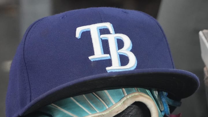 Sep 26, 2025; Toronto, Ontario, CAN; The hat and glove of Tampa Bay Rays third baseman Junior Caminero (13) in the dugout during the game against the Toronto Blue Jays at Rogers Centre. 