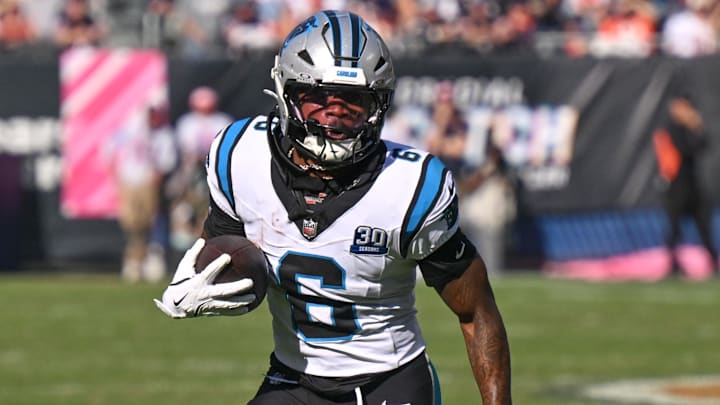 Oct 6, 2024; Chicago, Illinois, USA; Carolina Panthers running back Miles Sanders (6) runs after a catch against the Chicago Bears during the fourth quarter at Soldier Field. Mandatory Credit: Daniel Bartel-Imagn Images
