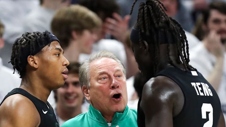 Dec 13, 2025; University Park, Pennsylvania, USA; Michigan State Spartans head coach Tom Izzo talks with guard Jeremy Fears Jr (1) and guard Kur Teng (2) during the second half against the Penn State Nittany Lions at Bryce Jordan Center. Mandatory Credit: Matthew O'Haren-Imagn Images Dec 13, 2025; University Park, Pennsylvania, USA; Michigan State Spartans head coach Tom Izzo talks with guard Jeremy Fears Jr (1) and guard Kur Teng (2) during the second half against the Penn State Nittany Lions at Bryce Jordan Center. Mandatory Credit: Matthew O'Haren-Imagn Images