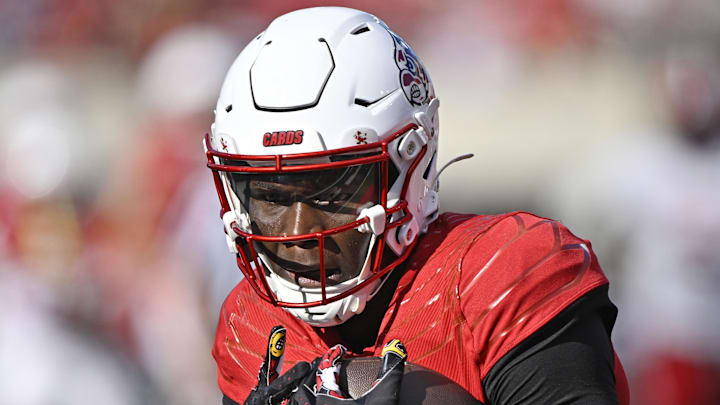 Sep 7, 2024; Louisville, Kentucky, USA;  Louisville Cardinals wide receiver Chris Bell (0) catches a pass against the Jacksonville State Gamecocks during the second half at L&N Federal Credit Union Stadium. Louisville defeated Jacksonville State 49-14. Mandatory Credit: Jamie Rhodes-Imagn Images