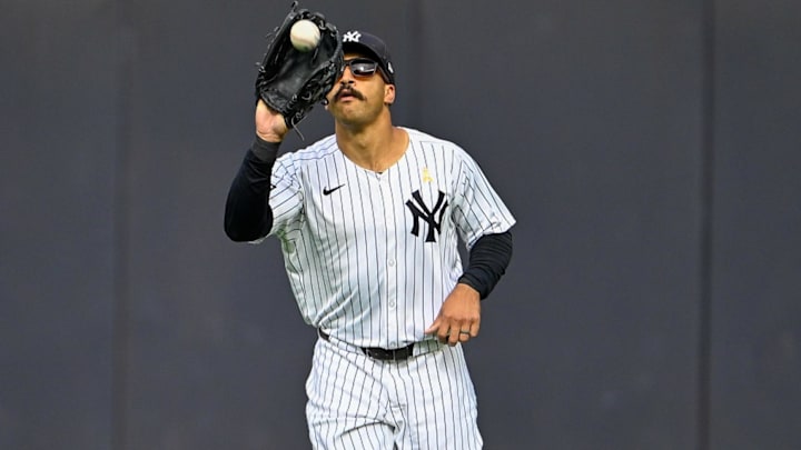 Sep 7, 2025; Bronx, New York, USA; New York Yankees center fielder Trent Grisham (12) catches a fly ball during the ninth inning against the Toronto Blue Jays at Yankee Stadium. Mandatory Credit: Mark Smith-Imagn Images