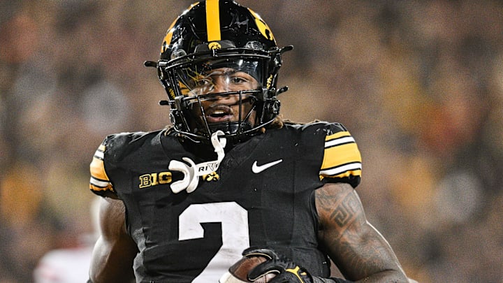 Nov 2, 2024; Iowa City, Iowa, USA;  Iowa Hawkeyes running back Kaleb Johnson (2) runs for a 16 yard touchdown against the Wisconsin Badgers during the second quarter at Kinnick Stadium. Mandatory Credit: Jeffrey Becker-Imagn Images