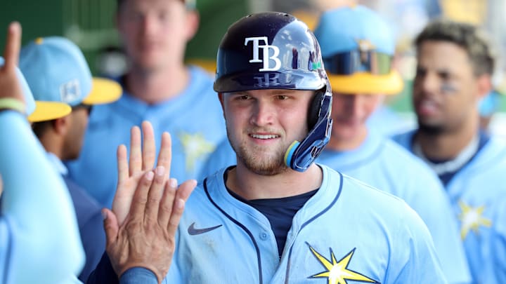 Mar 24, 2025; Clearwater, Florida, USA;  Tampa Bay Rays second base Curtis Mead (25) is congratulated after he scored a run during the fifth inning against the Philadelphia Phillies  at BayCare Ballpark. Mandatory Credit: Kim Klement Neitzel-Imagn Images