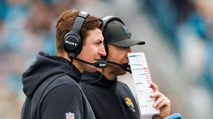 Jan 4, 2026; Jacksonville, Florida, USA; Jacksonville Jaguars offensive coordinator Grant Udinski and head coach Liam Coen during the second quarter against the Tennessee Titans at EverBank Stadium. Mandatory Credit: Morgan Tencza-Imagn Images