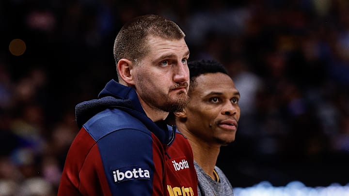 Dec 27, 2024; Denver, Colorado, USA; Denver Nuggets center Nikola Jokic (15) and guard Russell Westbrook (4) look on in the second quarter against the Cleveland Cavaliers at Ball Arena. Mandatory Credit: Isaiah J. Downing-Imagn Images