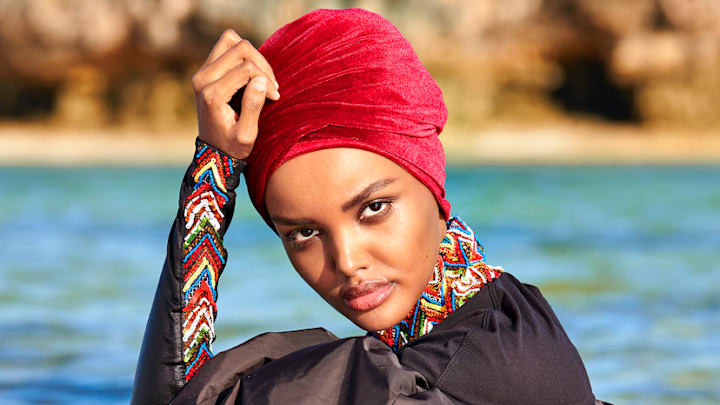 Halima Aden was photographed by Yu Tsai in Kenya. Burkini by No Ka'Oi.