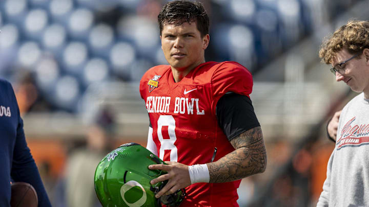 Jan 28, 2025; Mobile, AL, USA; National team quarterback Dillon Gabriel of Oregon (8) pauses after practice during Senior Bowl practice for the National team at Hancock Whitney Stadium. 