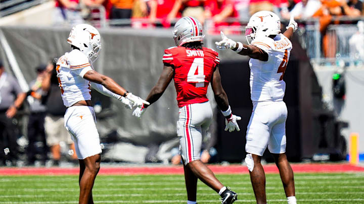 Texas Longhorns defensive back Malik Muhammad and defensive back Jelani McDonald react after Ohio State Buckeyes wide receiver Jeremiah Smith dropped a pass Texas Longhorns defensive back Malik Muhammad and defensive back Jelani McDonald react after Ohio State Buckeyes wide receiver Jeremiah Smith dropped a pass