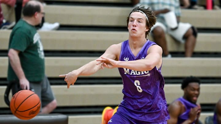Team Nano Magic's Denham Wojcik passes the ball in the game against Team Faygo on Thursday, June 23, 2022, during the Moneyball Pro-Am at Holt High School. Denham is the son of MSU assistant coach Doug Wojcik.

220623 Moneyball 015a